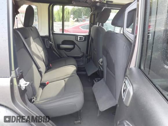 2021 Jeep Wrangler Unlimited Willys with VIN 1C4HJXDG2MW646904, listed as a IAAI auction lot 42267506 with 55,530 mi miles and . Bid and sale history available at DreamBid. Image 8.