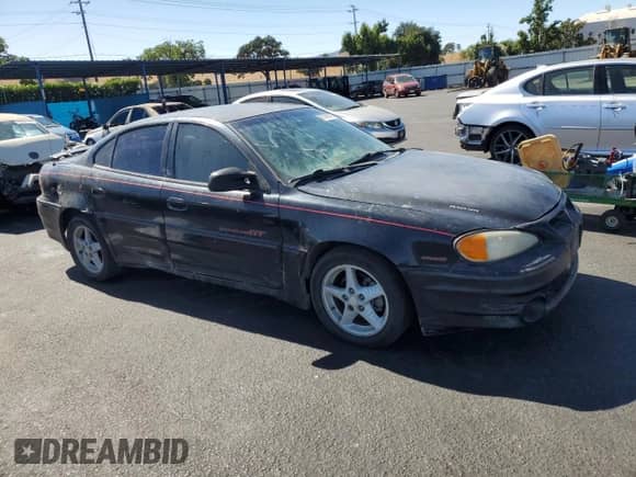 2000 Pontiac Grand Am GT z VIN 1G2NW52E3YC553038, wystawiony jako Copart lot #67668845 z przebiegiem 215 693 mil mil oraz Czysty tytuł • Clean title. Historia ofert i sprzedaży dostępna na DreamBid. Obrazek 4.