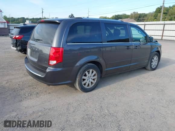 2014 Dodge Grand Caravan SXT with VIN 2C4RDGCG8ER223090, listed as a IAAI auction lot 43183331 with 207,135 mi miles and . Bid and sale history available at DreamBid. Image 4.