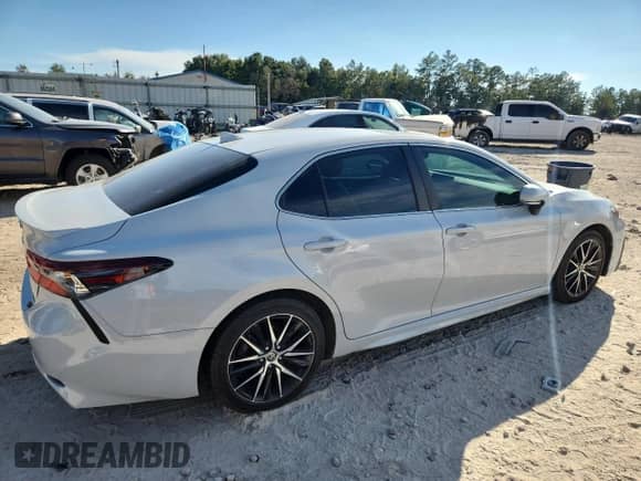 2023 Toyota Camry Hybrid SE with VIN 4T1S31AK8PU047880, listed as a Copart auction lot 84550705 with 75,409 mi miles and Clean title. Bid and sale history available at DreamBid. Image 3.