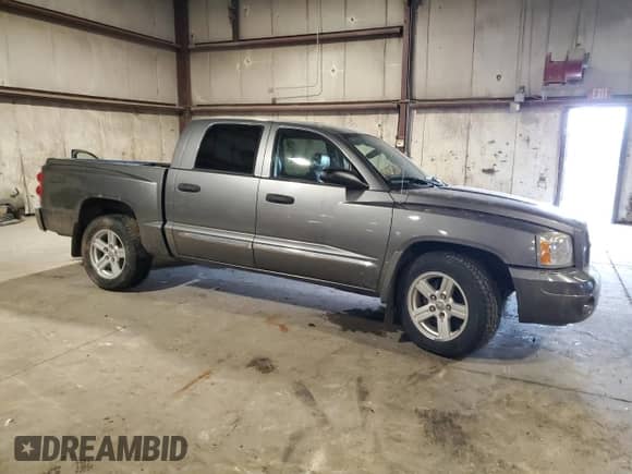 2007 Dodge Dakota Laramie with VIN 1D7HW58P77S270959, listed as a Copart auction lot 64900215 with 92,465 mi miles and Salvage title. Bid and sale history available at DreamBid. Image 4.