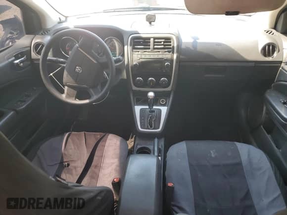 2010 Dodge Caliber SXT with VIN 1B3CB4HA5AD530259, listed as a Copart auction lot 70313555 with 184,173 mi miles and Salvage title. Bid and sale history available at DreamBid. Image 8.