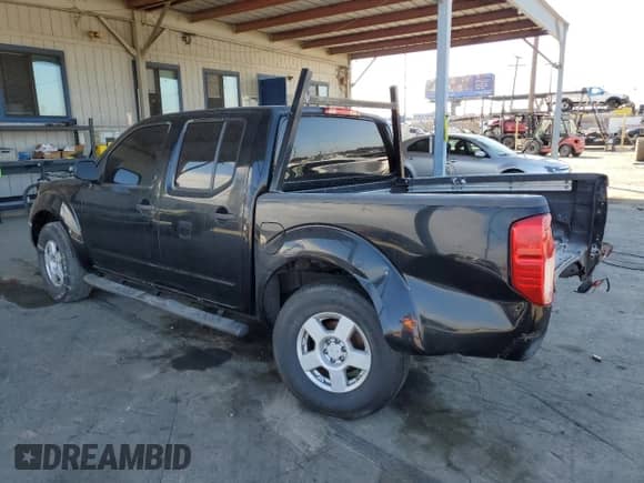 2006 Nissan Frontier LE with VIN 1N6AD07U86C402807, listed as a Copart auction lot 85923755 with 208,716 mi miles and Salvage title. Bid and sale history available at DreamBid. Image 2.