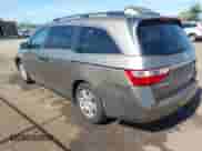 2013 Honda Odyssey LX with VIN 5FNRL5H27DB017516, listed as a IAAI auction lot 43245571 with 141,666 mi miles and . Bid and sale history available at DreamBid. Image 3.