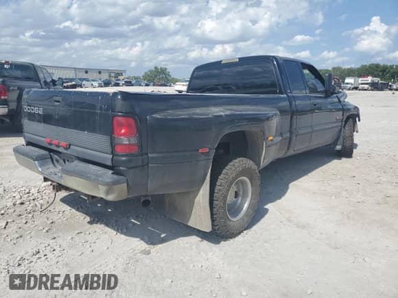 1999 Dodge 3500 with VIN 1B7MC3365XJ584328, listed as a Copart auction lot 62157015 with 221,754 mi miles and Salvage title. Bid and sale history available at DreamBid. Image 3.