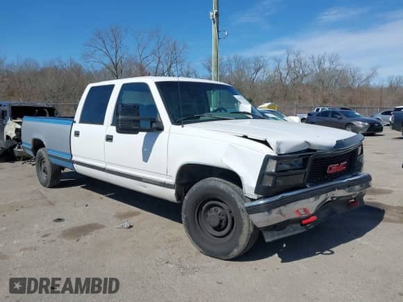 1996 GMC Sierra 1500 z VIN 1GTGC33R4TF018147, wystawiony jako IAAI lot #41612770 z przebiegiem 106 443 mil mil oraz . Historia ofert i sprzedaży dostępna na DreamBid. Obrazek 1.