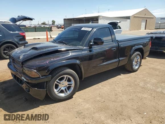 1999 Dodge Dakota SLT with VIN 1B7GL26Z9XS278840, listed as a Copart auction lot 65640885 with 62,454 mi miles and Salvage title. Bid and sale history available at DreamBid. Image 1.