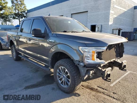 2018 Ford F-150 Lariat with VIN 1FTEW1E55JKC84715, listed as a Copart auction lot 82358275 with 58,594 mi miles and Salvage title. Bid and sale history available at DreamBid. Image 4.