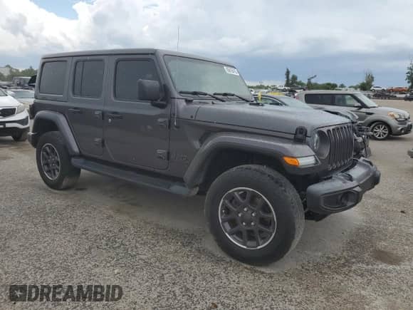 2021 Jeep Wrangler Unlimited Sahara High Altitude with VIN 1C4HJXENXMW617406, listed as a Copart auction lot 65618415 with 40,725 mi miles and Salvage title. Bid and sale history available at DreamBid. Image 4.