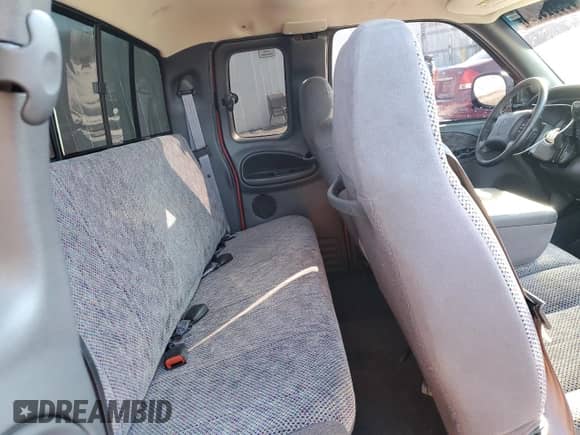 1999 Dodge 1500 with VIN 1B7HF13Y7XJ629428, listed as a Copart auction lot 88521915 with 106,489 mi miles and Salvage title. Bid and sale history available at DreamBid. Image 10.