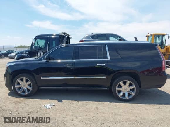 2015 Cadillac Escalade ESV Premium z VIN 1GYS4JKJ1FR290370, wystawiony jako IAAI lot #42798963 z przebiegiem 179 935 mil mil oraz . Historia ofert i sprzedaży dostępna na DreamBid. Obrazek 14.