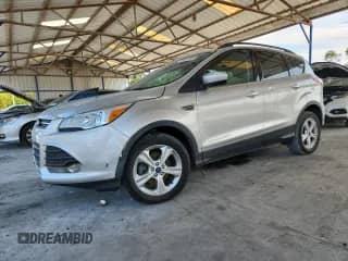 2014 Ford Escape SE z VIN 1FMCU0GX7EUC49282, wystawiony jako Copart lot #70480785 z przebiegiem 148 032 mil mil oraz Czysty tytuł • Clean title. Historia ofert i sprzedaży dostępna na DreamBid. Obrazek 1.