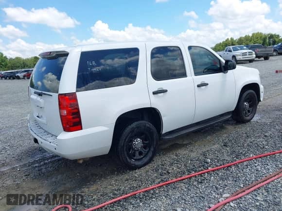 2013 Chevrolet Tahoe Commercial z VIN 1GNLC2E05DR327981, wystawiony jako IAAI lot #42835627 z przebiegiem 164 099 mil mil oraz . Historia ofert i sprzedaży dostępna na DreamBid. Obrazek 4.