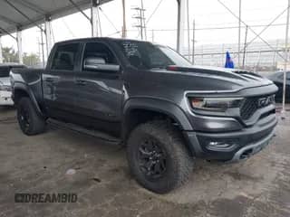 2023 Ram 1500 TRX z VIN 1C6SRFU91PN500263, wystawiony jako IAAI lot #41919761 z przebiegiem 18 150 mil mil oraz . Historia ofert i sprzedaży dostępna na DreamBid. Obrazek 1.