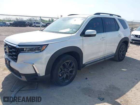 2023 Honda Pilot Touring с VIN 5FNYG2H77PB013738, выставлен на аукционе IAAI как лот 42013874 с пробегом 33 677 миль миль и . История ставок и продаж доступна на DreamBid. Изображение 17.