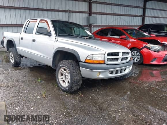 2003 Dodge Dakota Sport with VIN 1D7HG38N73S249488, listed as a IAAI auction lot 43033100 with 271,717 mi miles and . Bid and sale history available at DreamBid. Image 1.