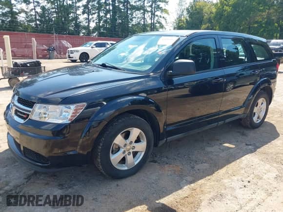 2013 Dodge Journey American Value z VIN 3C4PDCAB1DT665342, wystawiony jako IAAI lot #43204169 z przebiegiem 165 036 mil mil oraz . Historia ofert i sprzedaży dostępna na DreamBid. Obrazek 2.