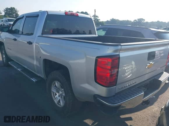 2014 Chevrolet Silverado 1500 LT with VIN 3GCPCREHXEG259073, listed as a IAAI auction lot 43010013 with 128,000 mi miles and . Bid and sale history available at DreamBid. Image 3.
