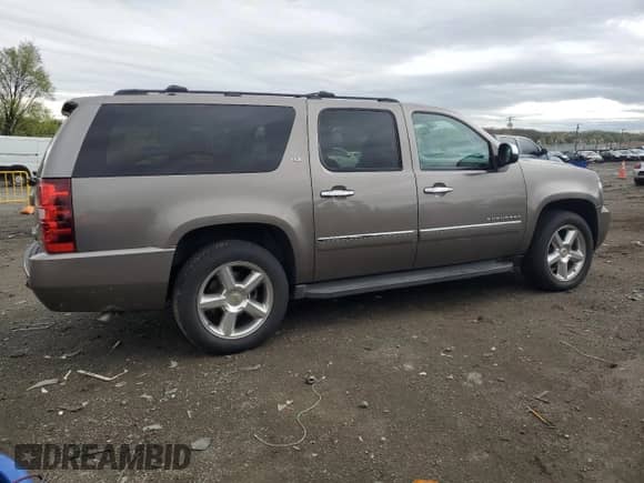 2012 Chevrolet Suburban LTZ z VIN 1GNSCKE07CR202068, wystawiony jako Copart lot #51771495 z przebiegiem 257 988 mil mil oraz Szkoda całkowita • Salvage title. Historia ofert i sprzedaży dostępna na DreamBid. Obrazek 3.