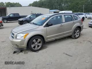 2010 Dodge Caliber SXT with VIN 1B3CB4HAXAD540088, listed as a Copart auction lot 68734845 with 153,998 mi miles and Salvage title. Bid and sale history available at DreamBid. Image 1.