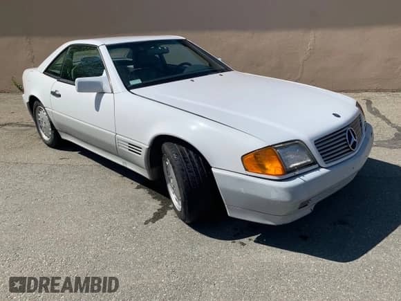 1992 Mercedes-Benz SL z VIN WDBFA66EXNF052820, wystawiony jako Copart lot #82759284 z przebiegiem 113 571 mil mil oraz Czysty tytuł • Clean title. Historia ofert i sprzedaży dostępna na DreamBid. Obrazek 1.