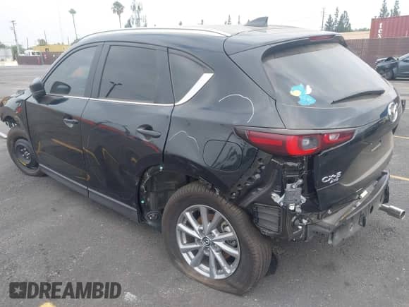 2023 Mazda CX-5 S Carbon Edition z VIN JM3KFBCMXP0132086, wystawiony jako IAAI lot #37026489 z przebiegiem 4 785 mil mil oraz . Historia ofert i sprzedaży dostępna na DreamBid. Obrazek 3.