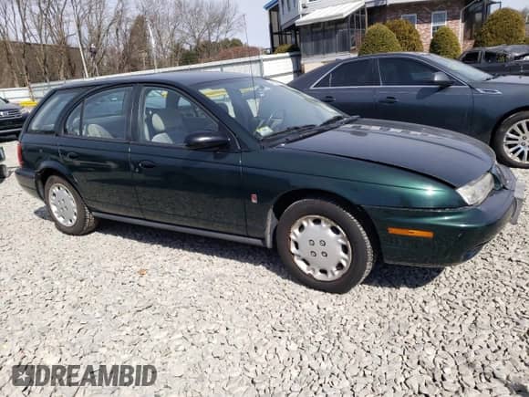 1997 Saturn SW with VIN 1G8ZK8275VZ129102, listed as a Copart auction lot 48857145 with 76,836 mi miles and Clean title. Bid and sale history available at DreamBid. Image 4.
