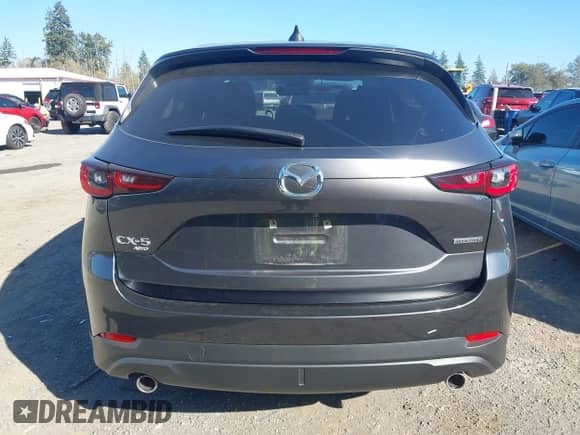 2023 Mazda CX-5 S Carbon Edition z VIN JM3KFBCM6P0143148, wystawiony jako IAAI lot #43382486 z przebiegiem 22 099 mil mil oraz . Historia ofert i sprzedaży dostępna na DreamBid. Obrazek 16.