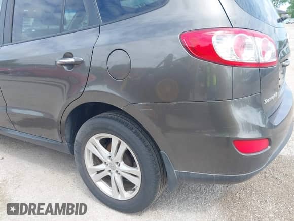 2012 Hyundai Santa Fe Limited with VIN 5XYZK4AG8CG118820, listed as a IAAI auction lot 42361850 with 298,744 mi miles and . Bid and sale history available at DreamBid. Image 13.