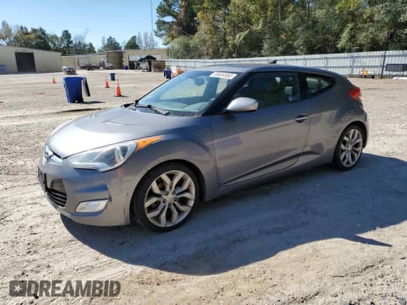 2013 Hyundai Veloster w/Black Int z VIN KMHTC6AD2DU144524, wystawiony jako Copart lot #86604965 z przebiegiem 101 979 mil mil oraz Czysty tytuł • Clean title. Historia ofert i sprzedaży dostępna na DreamBid. Obrazek 1.