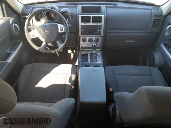 2011 Dodge Nitro SXT с VIN 1D4PT5GK5BW550369, выставлен на аукционе Copart как лот 49804245 с пробегом 141 212 миль миль и Списание • Salvage title. История ставок и продаж доступна на DreamBid. Изображение 8.