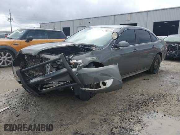 2012 Chevrolet Impala Police Police with VIN 2G1WD5E3XC1162170, listed as a Copart auction lot 70986324 with 148,208 mi miles and Salvage title. Bid and sale history available at DreamBid. Image 1.