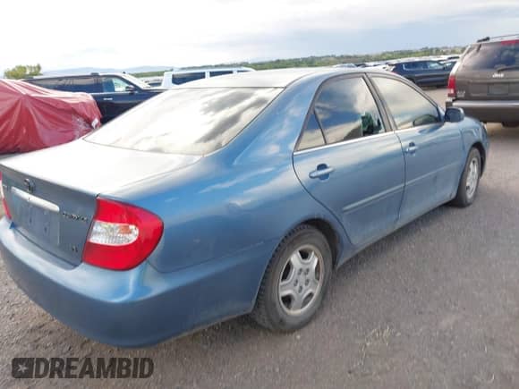 2003 Toyota Camry LE with VIN 4T1BF32K03U552842, listed as a IAAI auction lot 43221863 with 138,346 mi miles and . Bid and sale history available at DreamBid. Image 4.