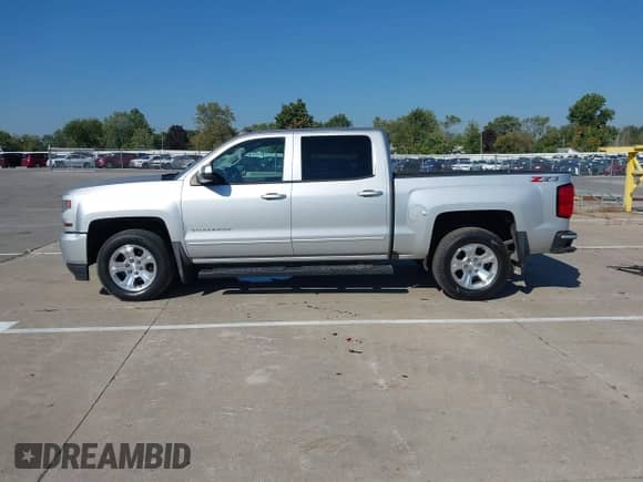2018 Chevrolet Silverado 1500 LT with VIN 3GCUKREC4JG339988, listed as a IAAI auction lot 43222960 with 162,440 mi miles and . Bid and sale history available at DreamBid. Image 14.