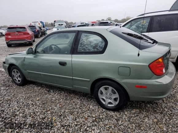 2003 Hyundai Accent GL с VIN KMHCG35C23U264701, выставлен на аукционе Copart как лот 80029154 с пробегом 142 090 миль миль и Списание • Salvage title. История ставок и продаж доступна на DreamBid. Изображение 2.