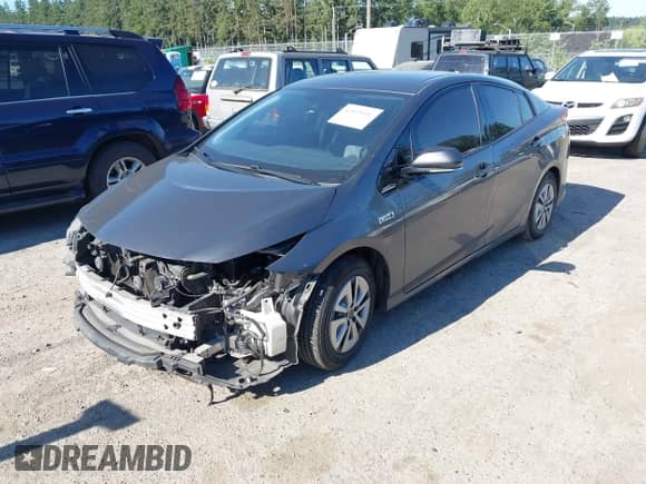 2018 Toyota Prius Plus z VIN JTDKARFP1J3071500, wystawiony jako IAAI lot #42665651 z przebiegiem 168 014 mil mil oraz . Historia ofert i sprzedaży dostępna na DreamBid. Obrazek 19.