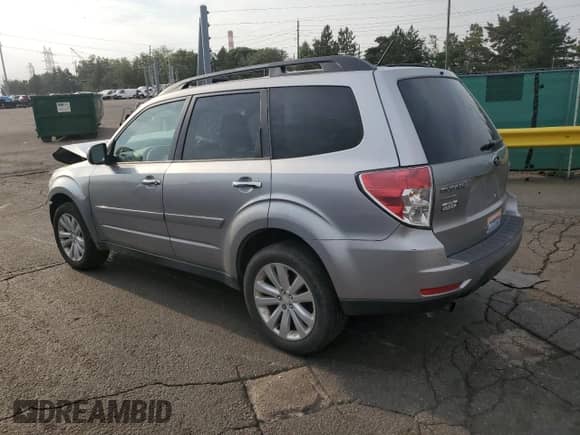 2011 Subaru Forester X Premium with VIN JF2SHADC1BH712339, listed as a Copart auction lot 66895135 with 183,845 mi miles and Salvage title. Bid and sale history available at DreamBid. Image 2.