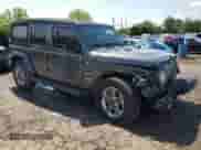 2022 Jeep Wrangler Unlimited Sahara with VIN 1C4HJXENXNW244773, listed as a Copart auction lot 59694095 with 21,871 mi miles and Salvage title. Bid and sale history available at DreamBid. Image 4.