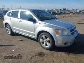 2010 Dodge Caliber SXT with VIN 1B3CB4HA4AD661148, listed as a IAAI auction lot 43507699 with 186,140 mi miles and . Bid and sale history available at DreamBid. Image 1.