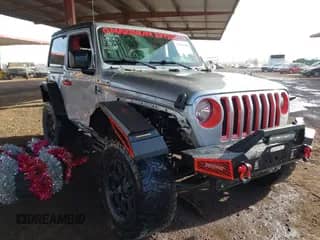 2020 Jeep Wrangler Sport S with VIN 1C4GJXAN9LW135767, listed as a IAAI auction lot 41236318 with 62,951 mi miles and . Bid and sale history available at DreamBid. Image 1.
