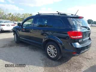 2014 Dodge Journey SXT with VIN 3C4PDCBG0ET141000, listed as a IAAI auction lot 43255379 with 199,750 mi miles and . Bid and sale history available at DreamBid. Image 3.