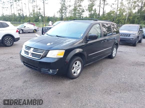2010 Dodge Grand Caravan SXT with VIN 2D4RN5D19AR409651, listed as a IAAI auction lot 43335959 with 179,715 mi miles and . Bid and sale history available at DreamBid. Image 2.