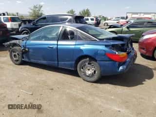 2001 Saturn SC с VIN 1G8ZR12731Z256766, выставлен на аукционе Copart как лот 70595904 с пробегом Не указан миль и Списание • Salvage title. История ставок и продаж доступна на DreamBid. Изображение 2.