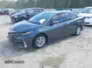 2022 Toyota Prius Limited with VIN JTDKAMFP6N3201845, listed as a IAAI auction lot 43216746 with 82,457 mi miles and . Bid and sale history available at DreamBid. Image 2.