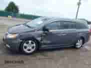 2012 Honda Odyssey Touring z VIN 5FNRL5H95CB132398, wystawiony jako IAAI lot #42789552 z przebiegiem 169 861 mil mil oraz . Historia ofert i sprzedaży dostępna na DreamBid. Obrazek 6.