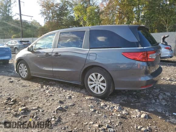 2020 Honda Odyssey LX with VIN 5FNRL6H20LB047462, listed as a Copart auction lot 82296145 with 61,618 mi miles and Salvage title. Bid and sale history available at DreamBid. Image 2.