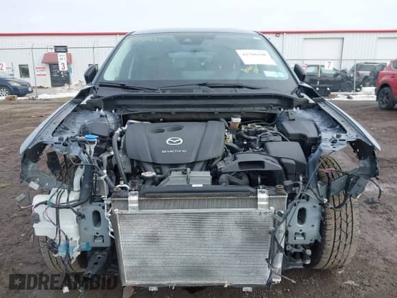 2022 Mazda CX-5 S Carbon Edition z VIN JM3KFBCM2N0529241, wystawiony jako IAAI lot #41708100 z przebiegiem 24 139 mil mil oraz . Historia ofert i sprzedaży dostępna na DreamBid. Obrazek 6.