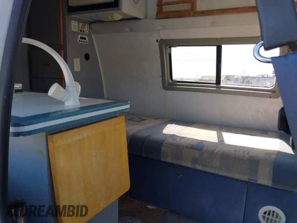 1996 Ford Econoline Cargo with VIN 1FDHS24H9THA55752, listed as a IAAI auction lot 42052800 with 117,680 mi miles and . Bid and sale history available at DreamBid. Image 8.