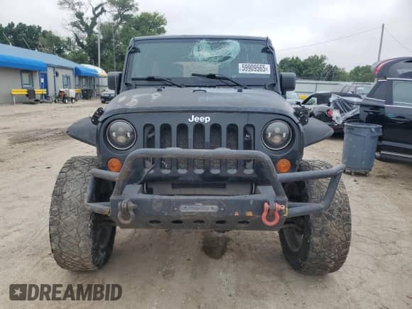 2007 Jeep Wrangler Unlimited Rubicon with VIN 1J4GA69117L112867, listed as a Copart auction lot 59909565 with 166,963 mi miles and Salvage title. Bid and sale history available at DreamBid. Image 5.