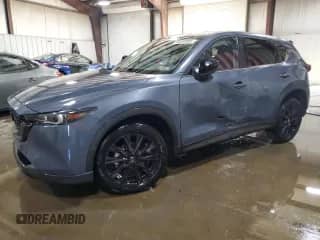 2023 Mazda CX-5 S Preferred z VIN JM3KFBCM4P0196107, wystawiony jako Copart lot #80030085 z przebiegiem 24 534 mil mil oraz Szkoda całkowita • Salvage title. Historia ofert i sprzedaży dostępna na DreamBid. Obrazek 1.